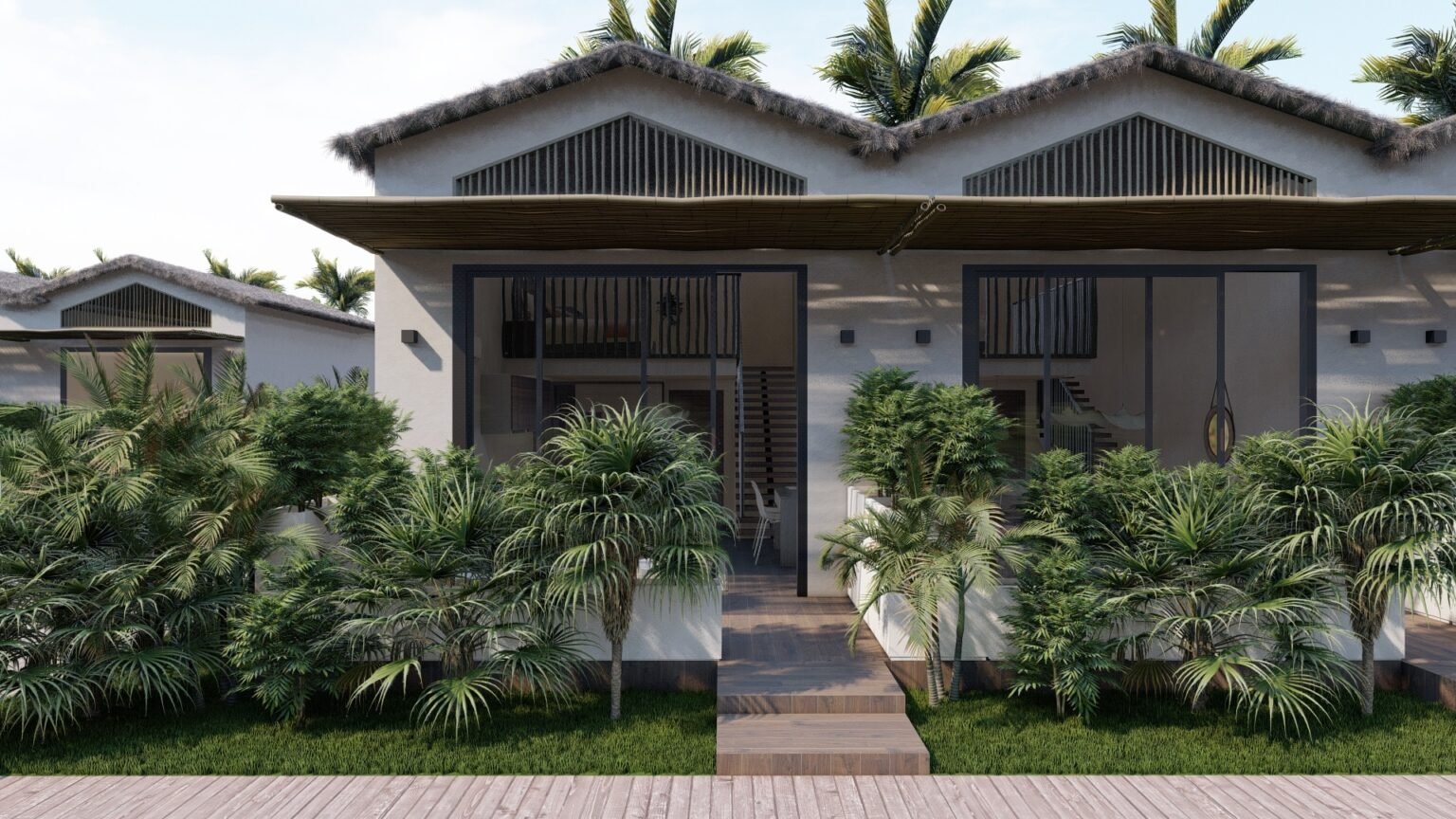 Exterior of Land of Nomads eco-villas in San Fernando — thatched roofs and tropical gardens